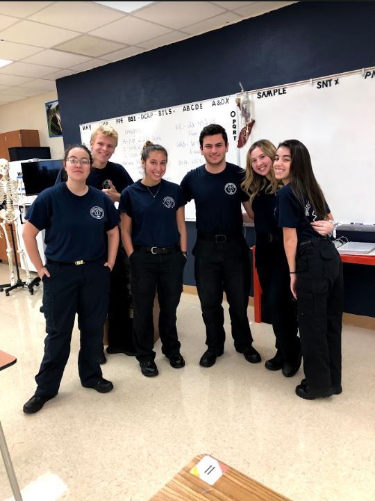 Here are  few students that take EMT at West Boca wearing their uniform.