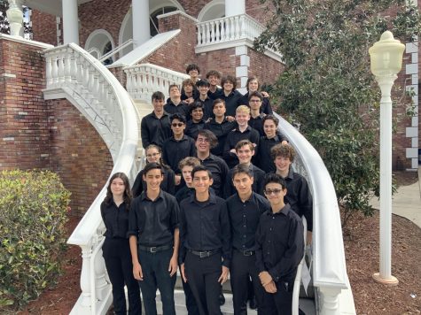 The jazz band celebrating their superior performance on the steps of the American Heritage auditorium.