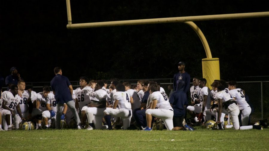 West Boca Head Coach, Dylan Spotts, speaks to his team after the tough loss against Boynton Beach.