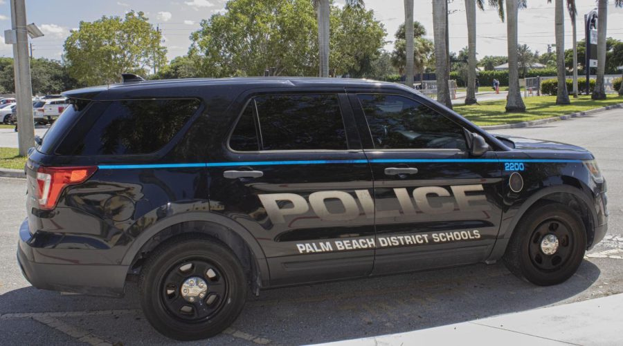 A District Police vehicle parked at the main gate at West Boca High.