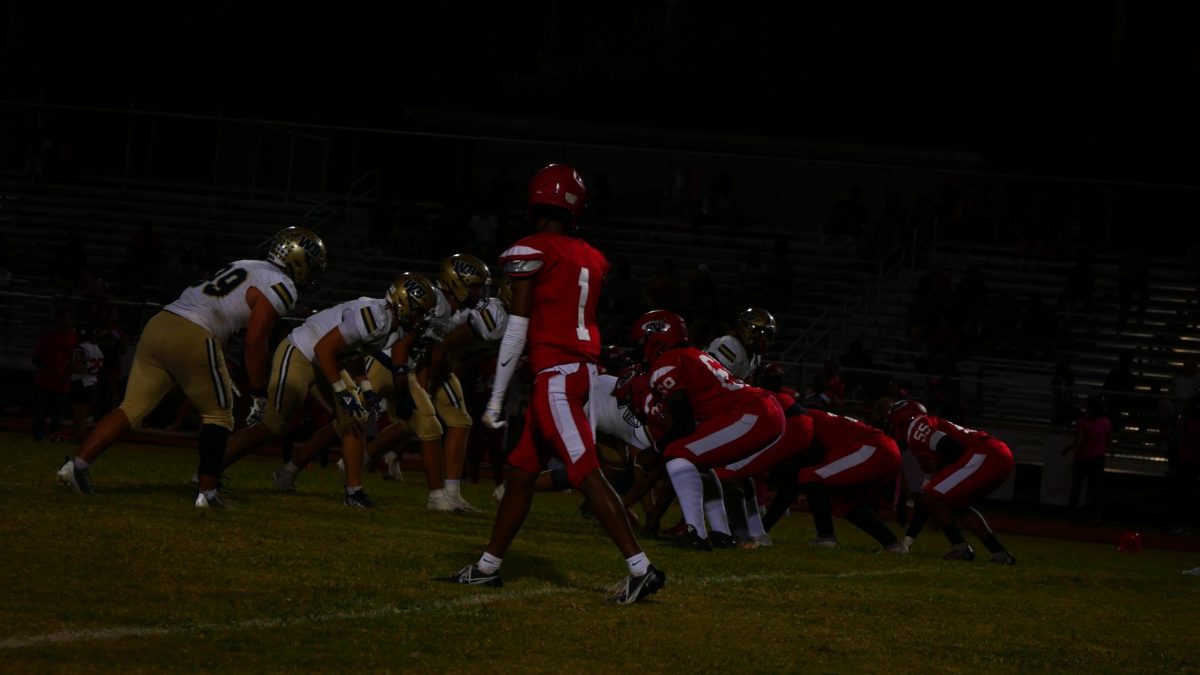 West Bocas defensive line lined up against Northeasts offensive line ahead of a snap.