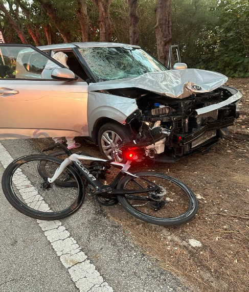Photo of car and broken bike after car accident in South Florida