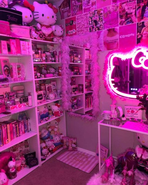 Room filled with pink light and decorated with Hello Kitty Items. 