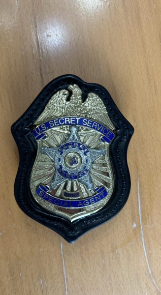 The badge featured belongs to a United States Secret Service Agent.