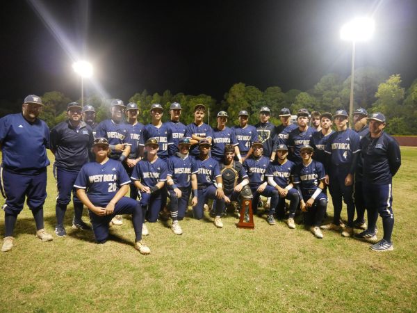 West Boca takes a group picture with the district championship trophy.
