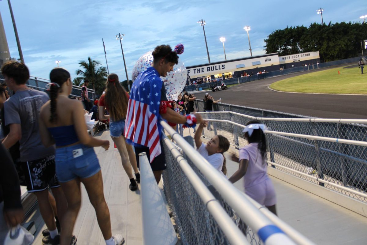 Mr. Bull playing with the little kids at the USA football game. 