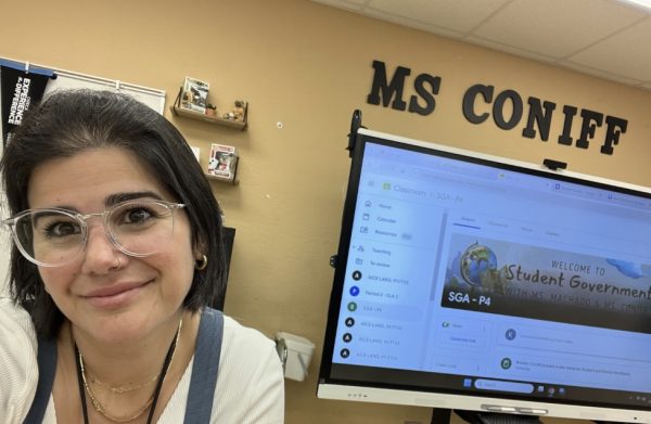 Picture of Ms. Coniff in her classroom where she teaches Pre-AICE, AICE, and SGA.