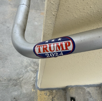 Image of a TRUMP political sticker on the school staircase at West Boca