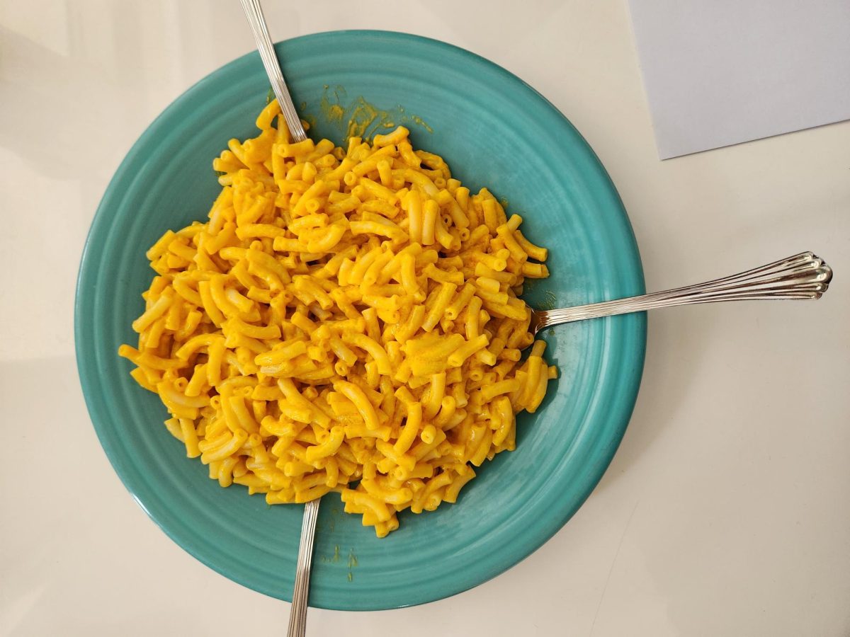 A box of Mac and Cheese to be split between three people.