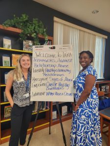 Ms. Jannelle Henry and Ms. Grace Taylor greeting students as they come in to TARA training.