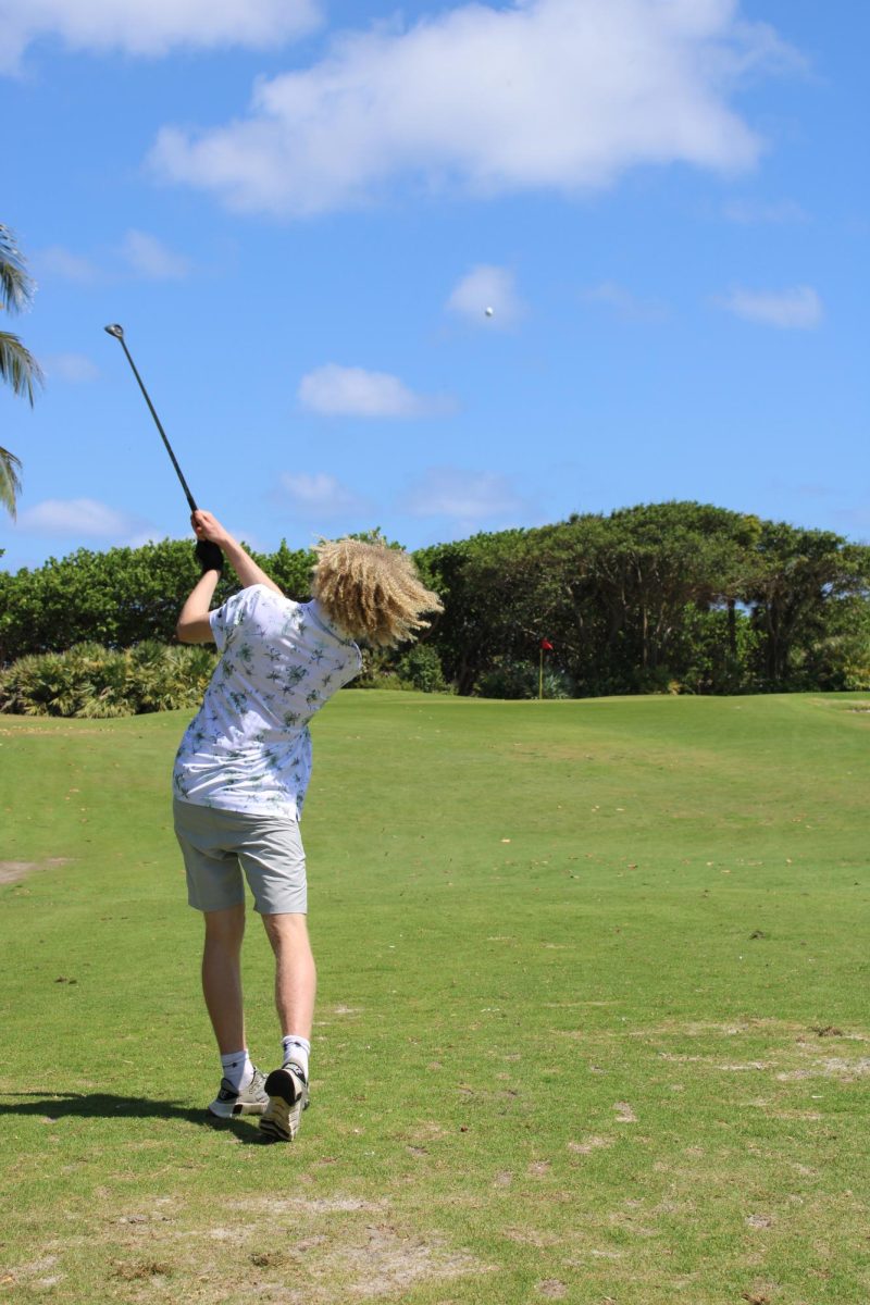 Student of WBHS, Jeremy Cislo, playing golf